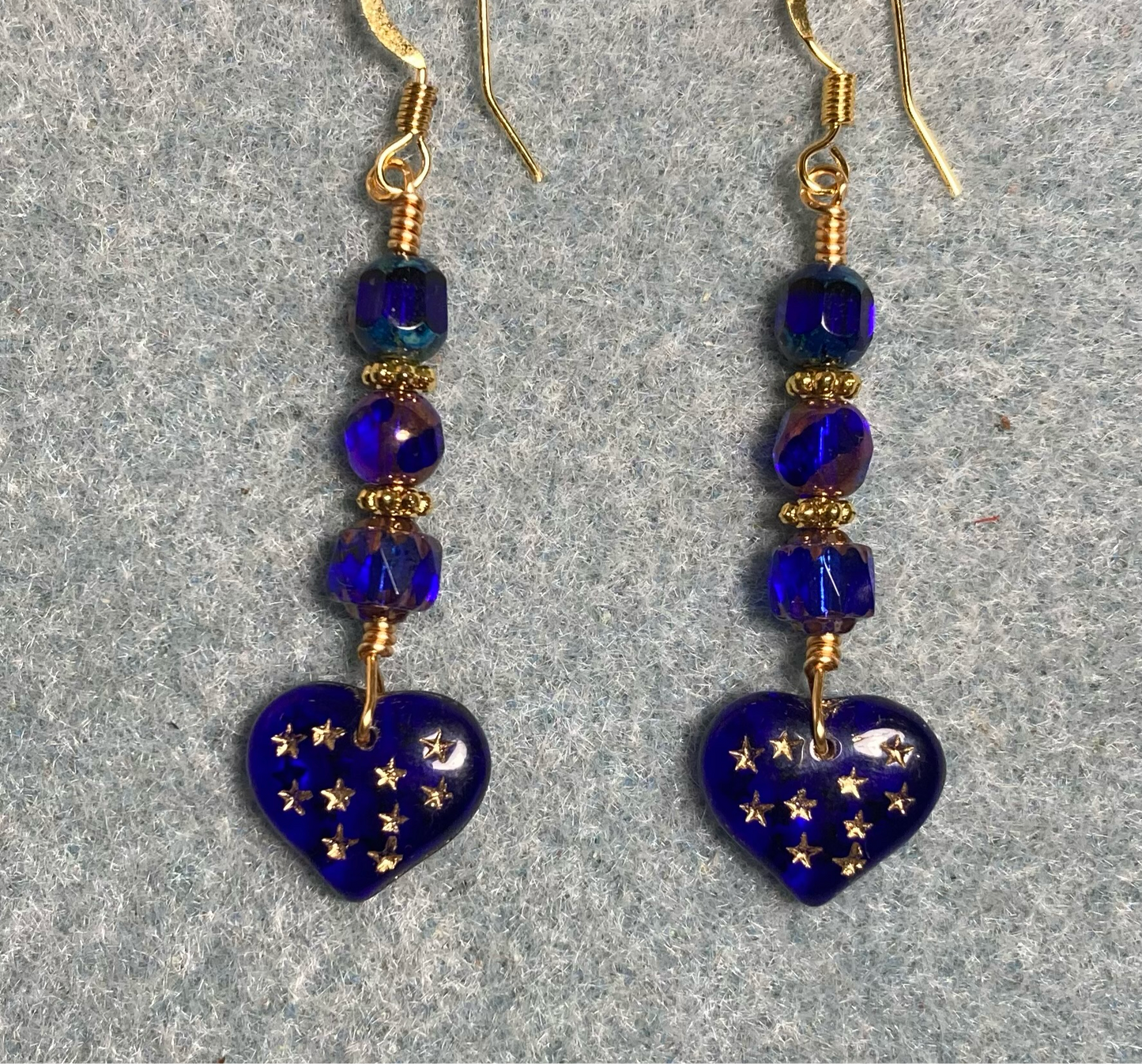 Dark blue Czech glass heart bead earrings adorned with dark blue Czech glass beads.