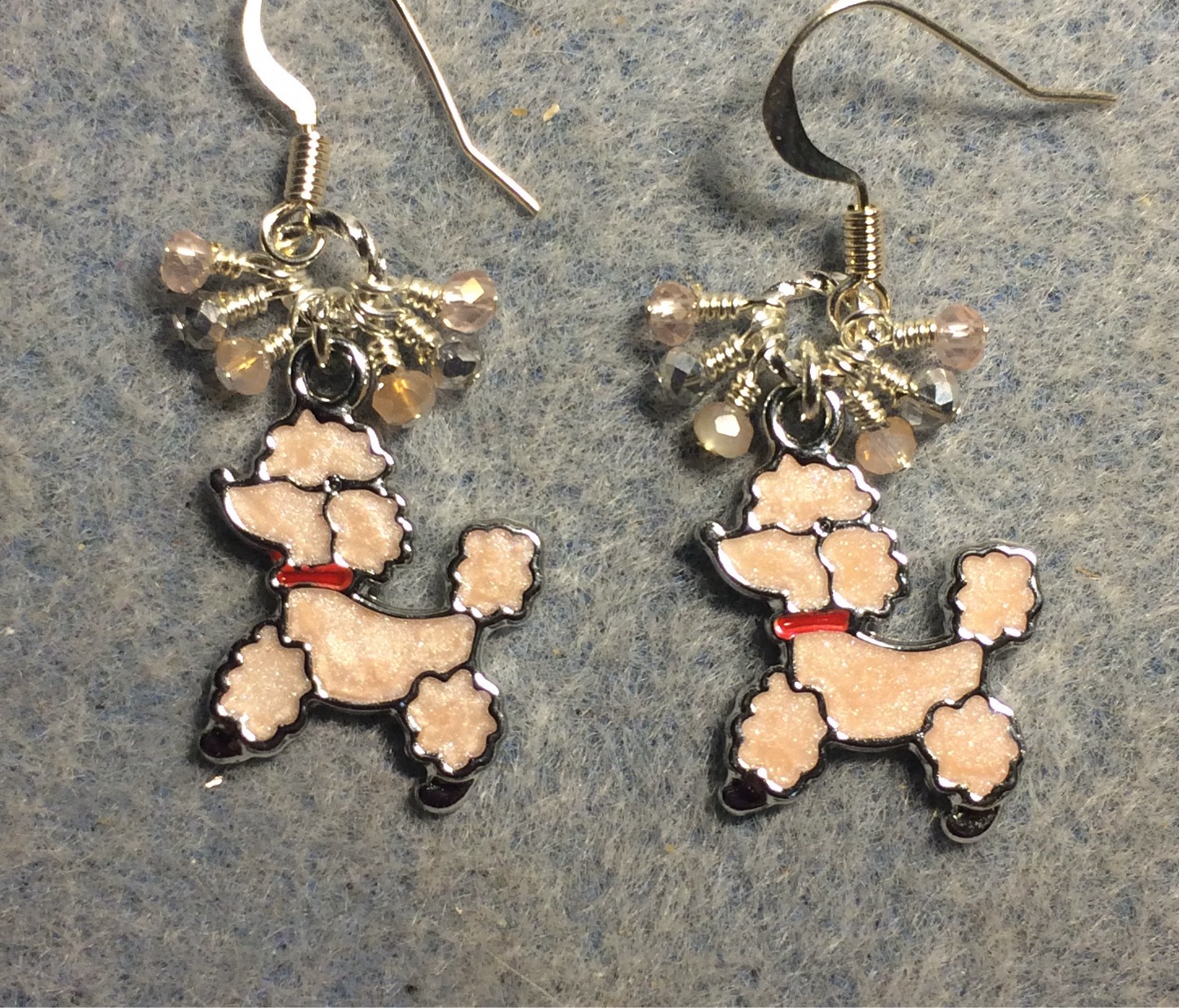 Pink and red enamel poodle charm earrings adorned with tiny dangling pink and silver Chinese crystal beads.
