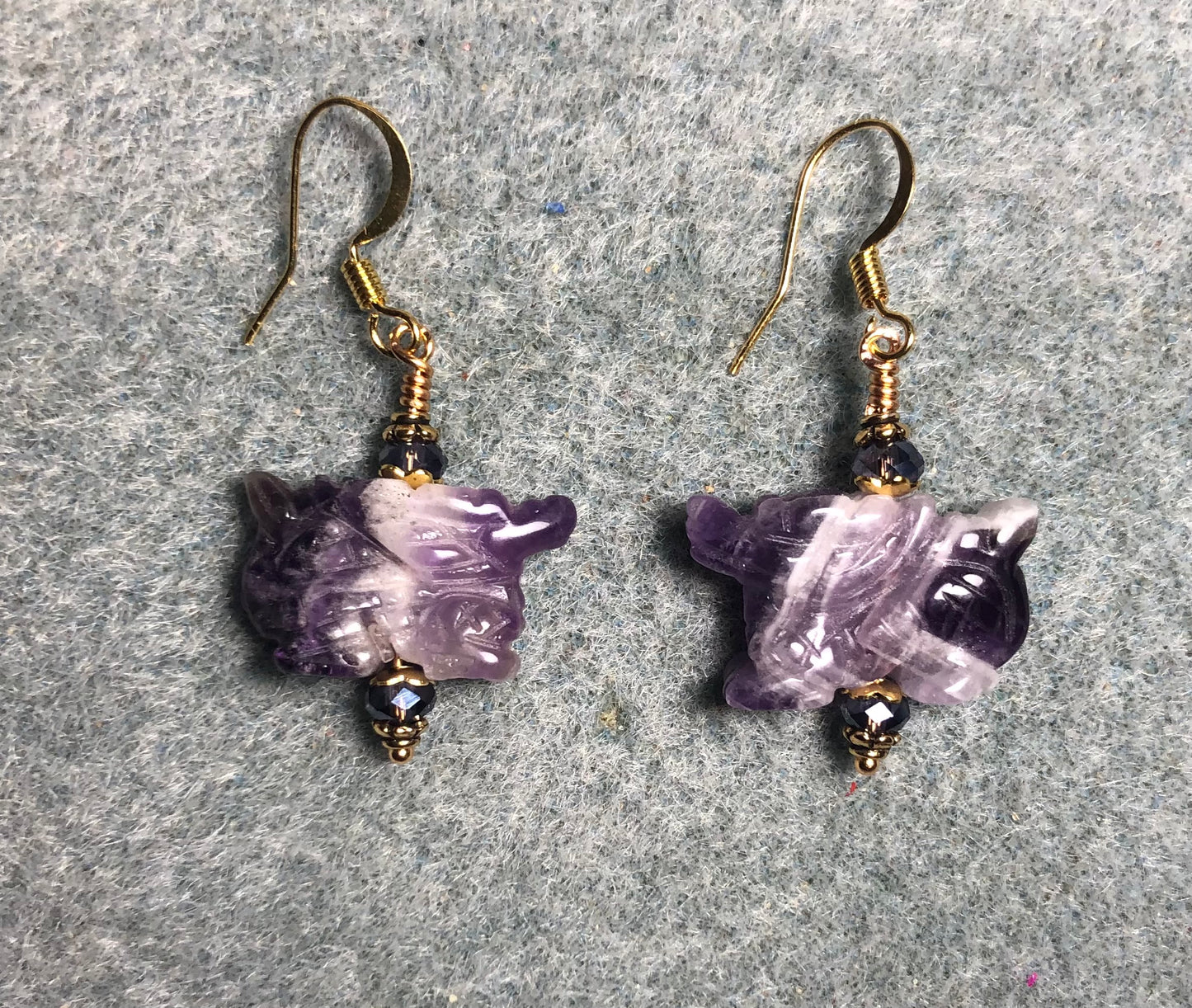 Genuine amethyst gemstone dragon bead earrings adorned with purple Chinese crystal beads.