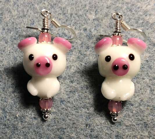 White and pink lamp work standing pig bead earrings adorned with pink Czech glass beads.