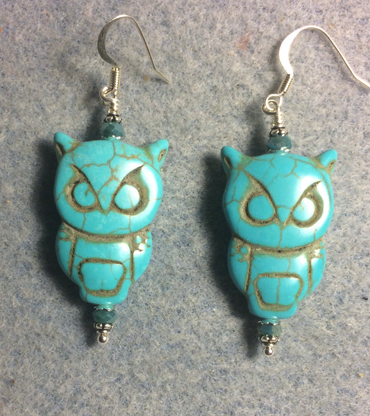 Large turquoise howlite gemstone owl bead earrings adorned with turquoise Chinese crystal beads.