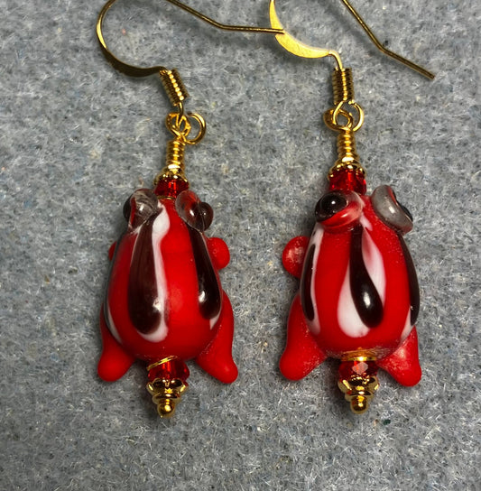 Very small red with black stripes lamp work frog bead earrings adorned with red Chinese crystal beads.