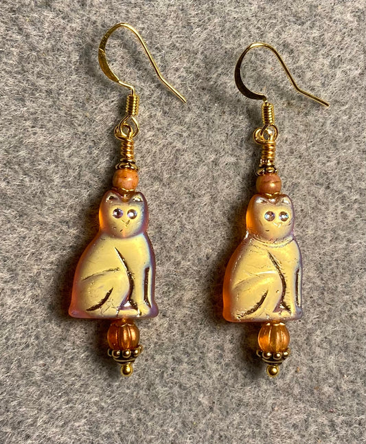Metallic orange Czech glass cat bead earrings adorned with orange Czech glass beads.