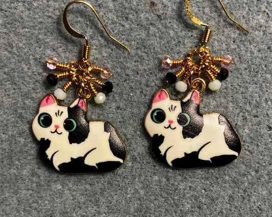 Black, white, and pink enamel cat charm earrings adorned with tiny dangling black, white, and pink Chinese crystal beads.