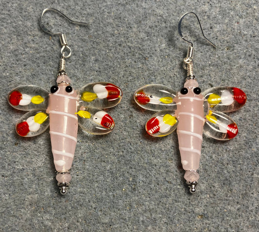 Pink, red, and yellow lamp work dragonfly bead earrings adorned with pink Chinese crystal beads.