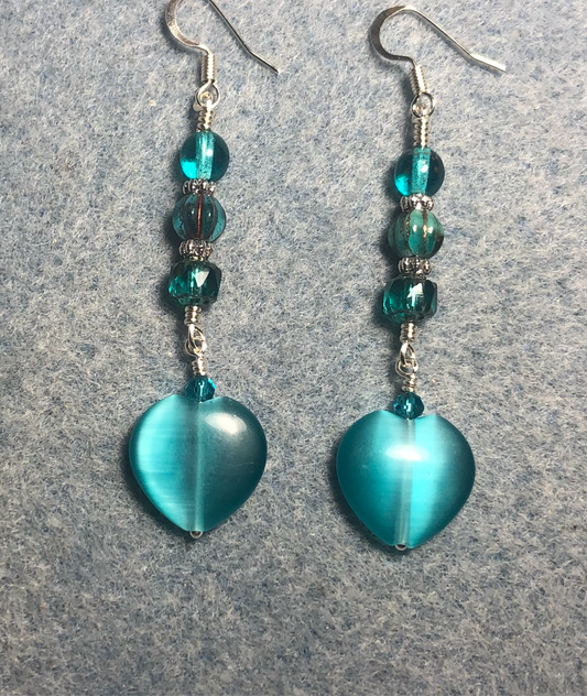 Turquoise teal fiber optic (cat’s eye) Czech glass heart bead earrings adorned with turquoise teal Czech glass beads.