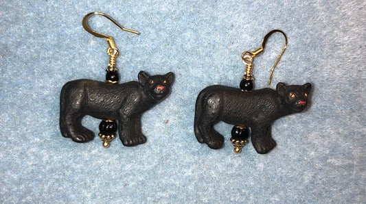 Black ceramic panther bead earrings adorned with black Czech glass beads.