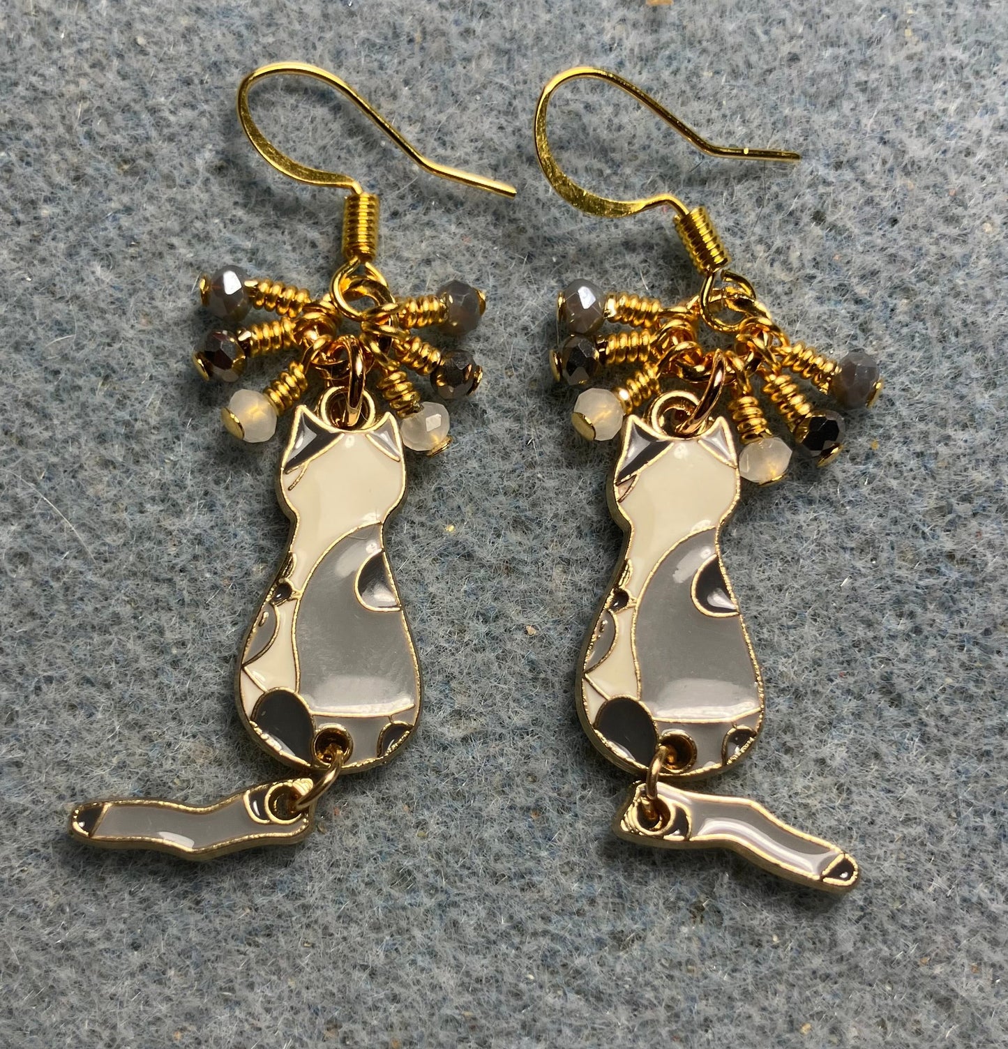 Dark gray , light gray, and white enamel cat charm earrings adorned with tiny dangling dark gray, light gray, and white Chinese crystal beads.
