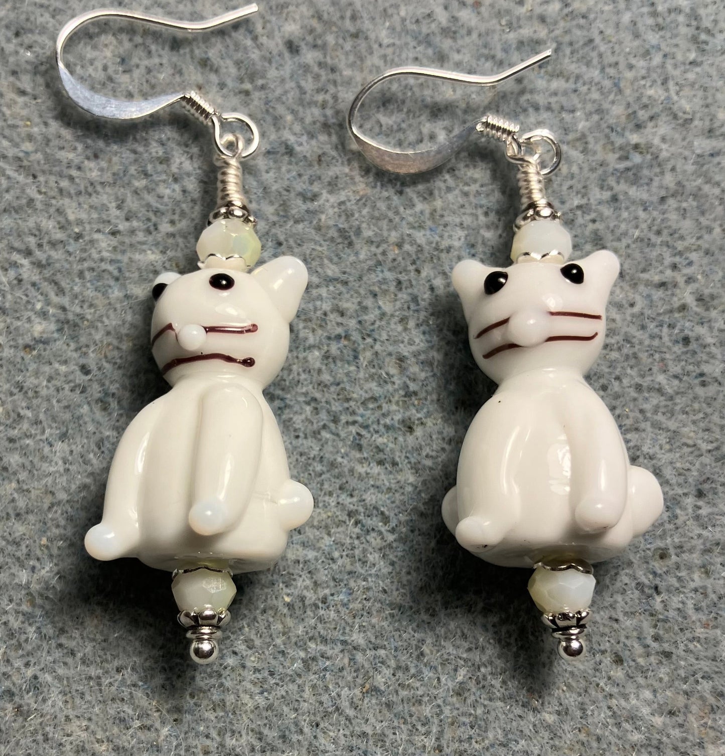 Opaque white lamp cat bead earrings adorned with white Chinese crystal beads.