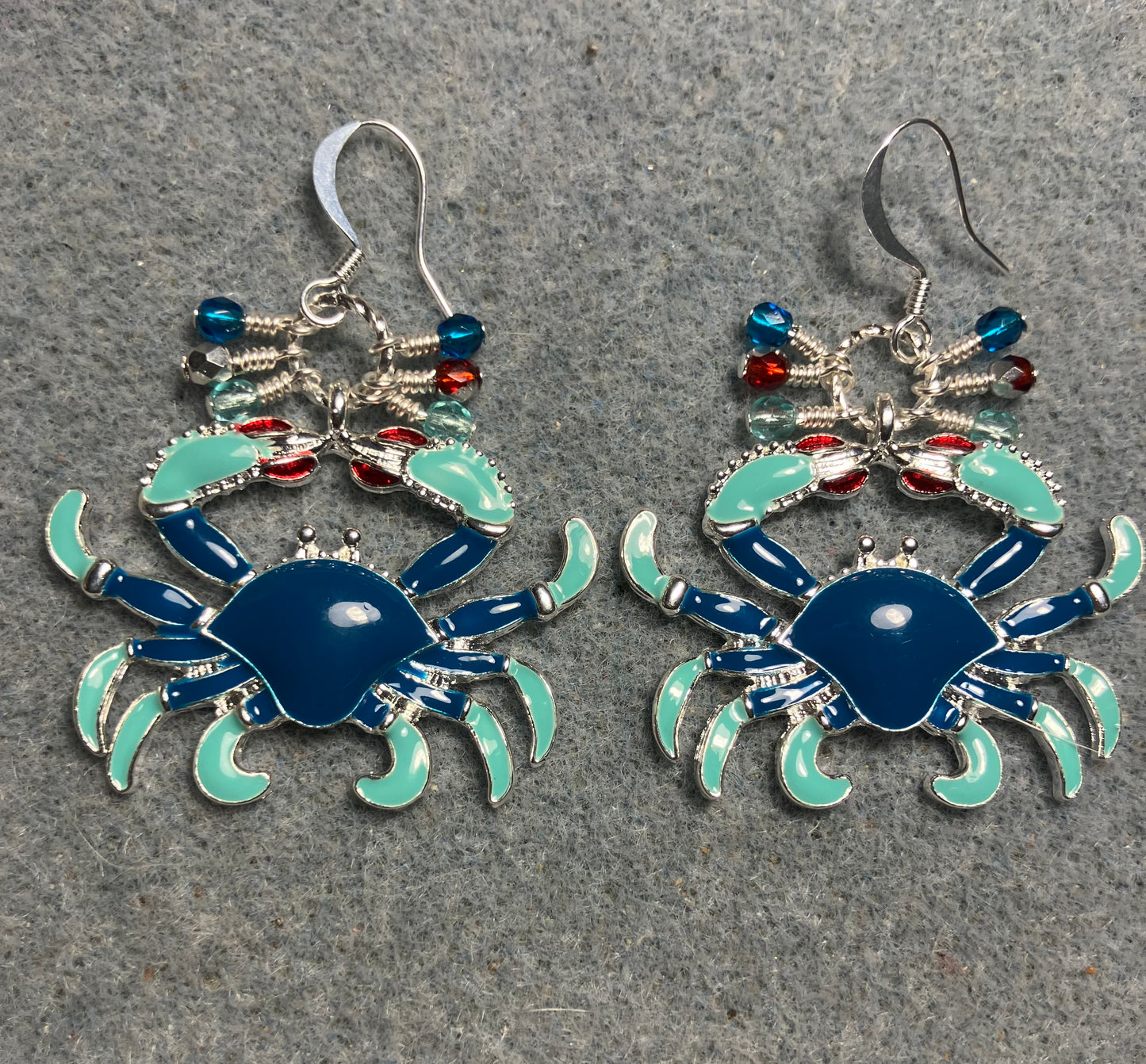 Large blue, aqua, and red enamel crab charm earrings adorned with small dangling blue, aqua, and red Czech glass beads.