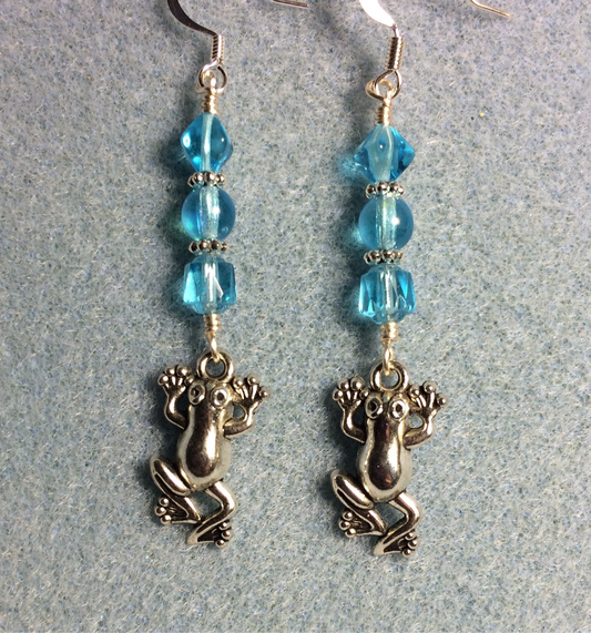 Silver frog charm earrings adorned with light turquoise Czech glass beads