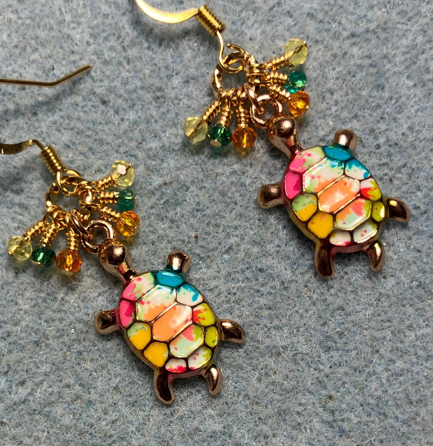Orange, teal, yellow, and pink enamel turtle charm earrings adorned with tiny dangling orange, teal, yellow, and pink Chinese crystal beads.