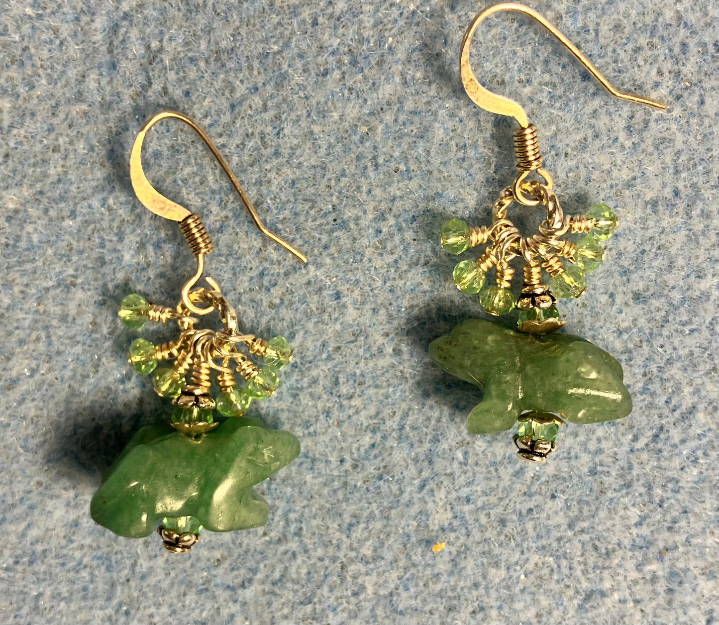 Small green aventurine gemstone frog bead earrings adorned with tiny dangling green Chinese crystal beads.