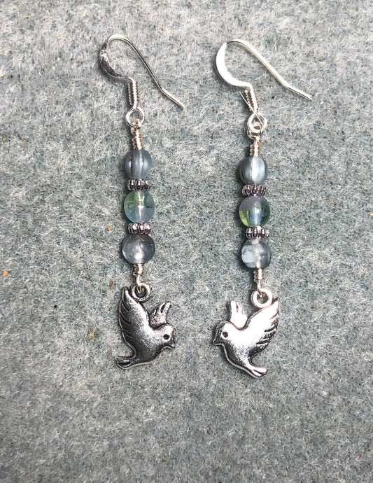 Silver dove charm earrings adorned with small light blue Czech glass beads