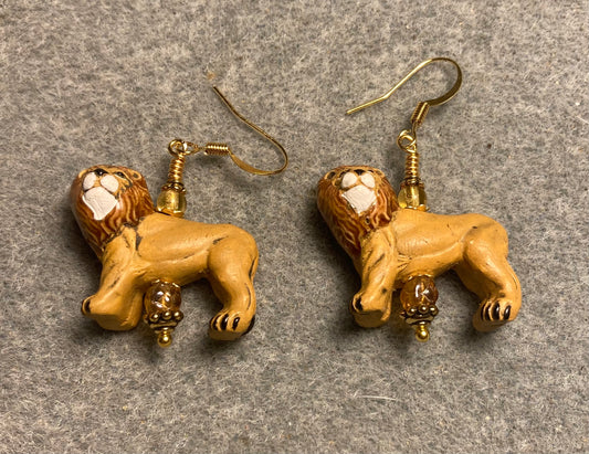 Topaz ceramic lion bead earrings adorned with topaz Czech glass beads.