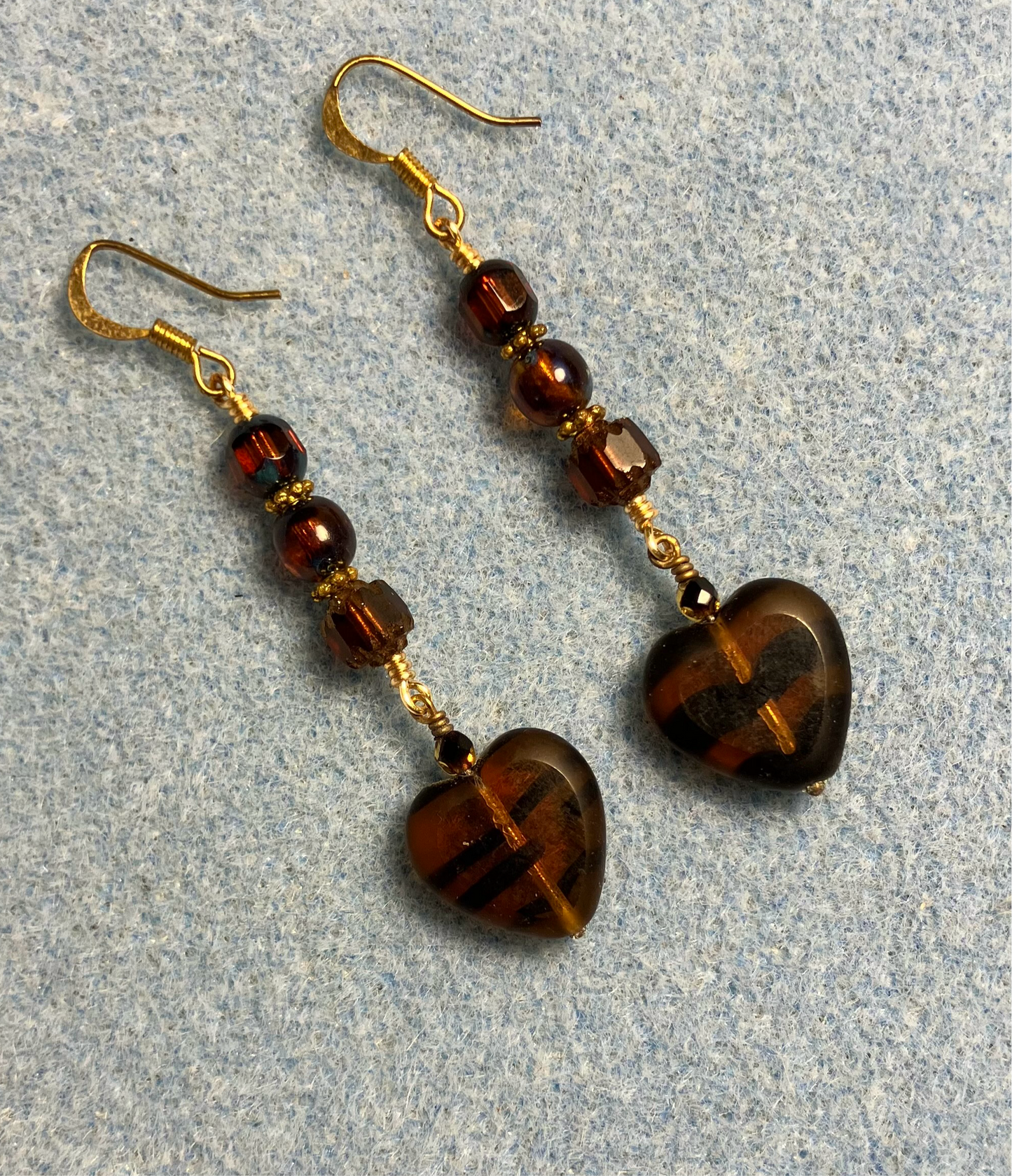 Brown tiger striped Czech glass heart bead earrings adorned with brown Czech glass beads.