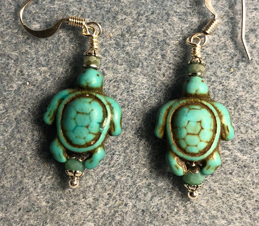 Turquoise howlite gemstone turtle bead earrings adorned with turquoise Chinese crystal beads.