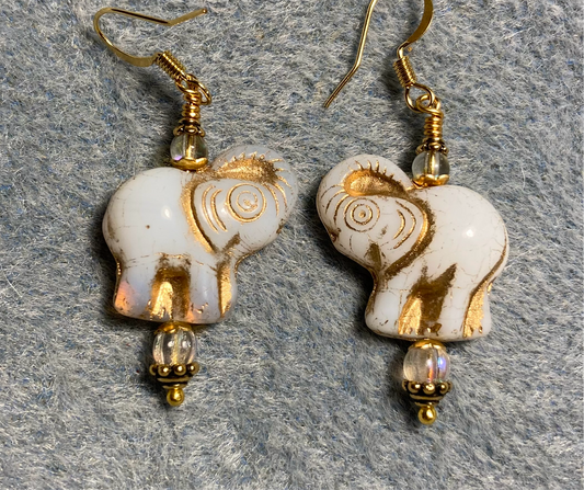 Opaque white (with gold inlay) Czech glass elephant bead earrings adorned with clear Czech glass beads.