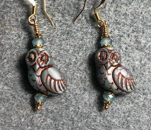 Light blue (with copper wash) fancy Czech glass owl bead earrings adorned with light blue Chinese crystal beads.
