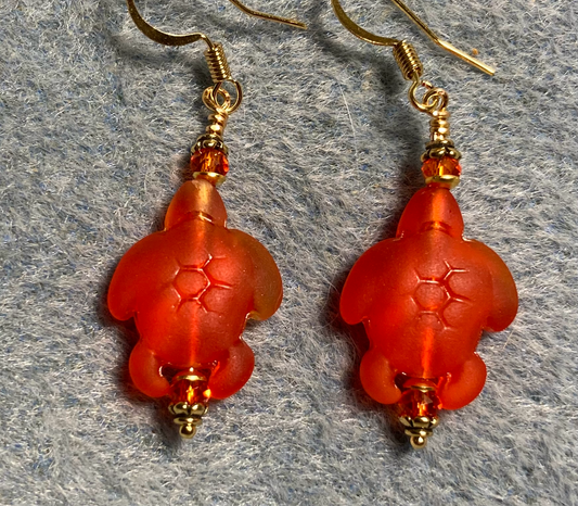 Orange red sea glass sea turtle bead earrings adorned with orange red Chinese crystal beads.