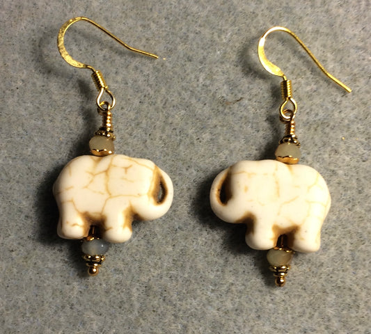 Light tan howlite gemstone elephant bead earrings adorned with tan Chinese crystal beads.