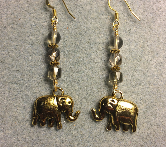 Large gold elephant charm earrings adorned with gray Czech glass beads.