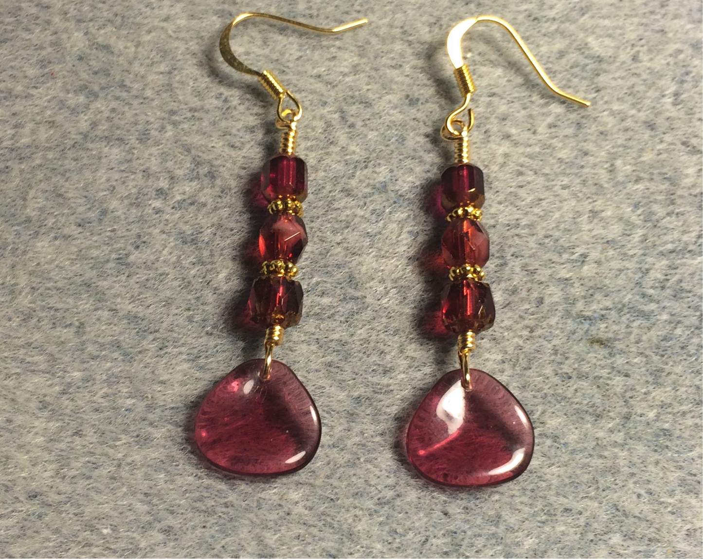 Translucent fuchsia Czech glass rose petal earrings adorned with fuchsia Czech glass beads.