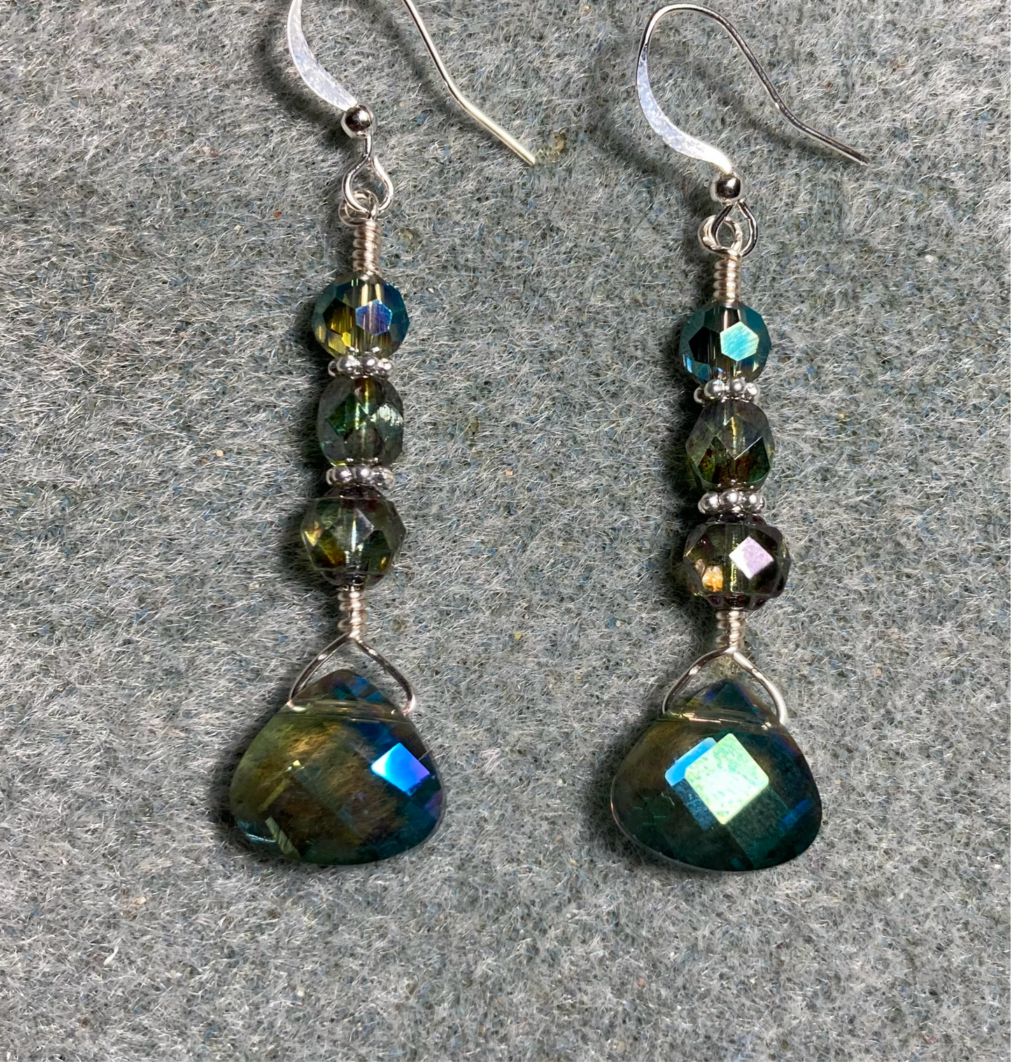 Sparkly blue green Czech glass briolette bead earrings adorned with blue green Czech glass beads.