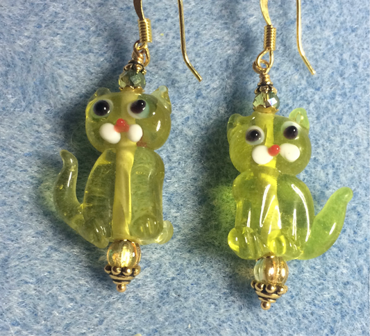 Translucent lime green lamp work cat bead earrings adorned with lime green Czech glass beads.