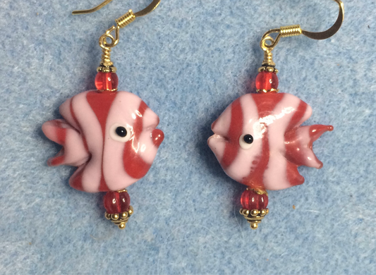 Red and pink lamp work striped angelfish bead earrings adorned with red Czech glass beads.