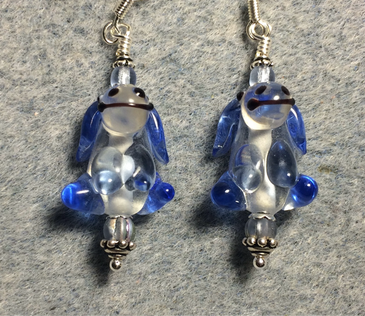 Light blue and clear lamp work puppy dog bead earrings adorned with light blue Czech glass beads.