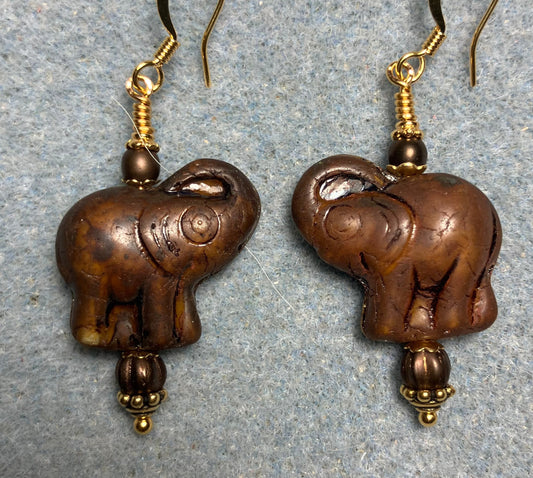 Dark brown Czech glass elephant bead earrings adorned with dark brown Czech glass beads.