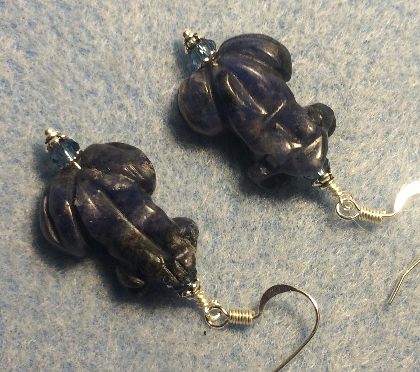 Blue sodalite gemstone frog bead earrings adorned with blue Chinese crystal beads.