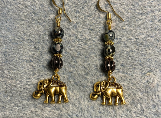 Small fancy gold elephant charm earrings adorned with black Picasso Czech glass beads.