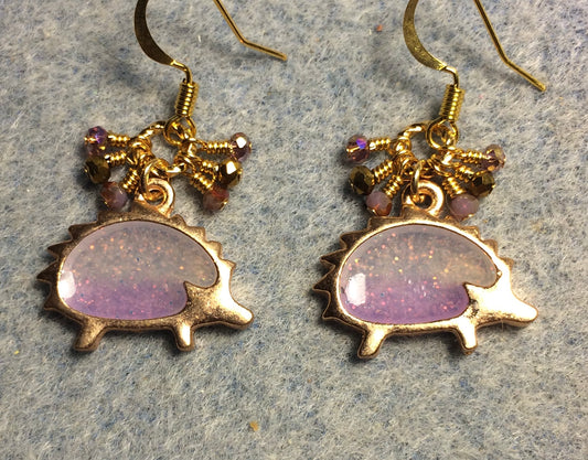 Gold and sparkly purple resin hedgehog charm earrings adorned with tiny dangling purple and gold Chinese crystal beads.