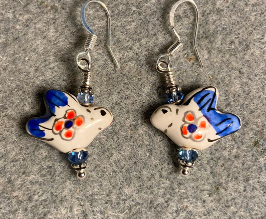 Light blue and white ceramic dove bead earrings adorned with light blue Chinese crystal beads.