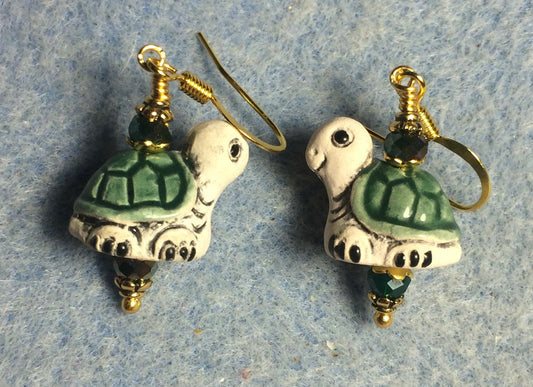 Small dark green and tan ceramic turtle bead earrings adorned with dark green Chinese crystal beads.