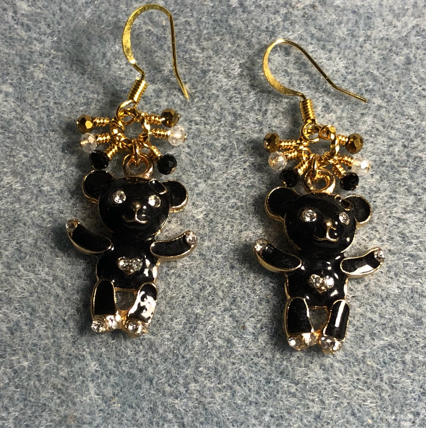 Black enamel and rhinestone teddy bear charm earrings adorned with tiny dangling black, gold, and clear Chinese crystal beads.