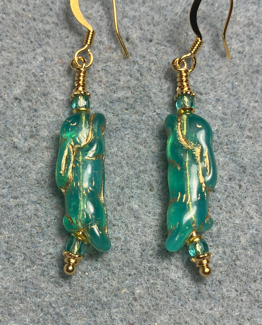 Small teal (with gold inlay) Czech glass bunny rabbit bead earrings adorned with small teal Czech glass beads.