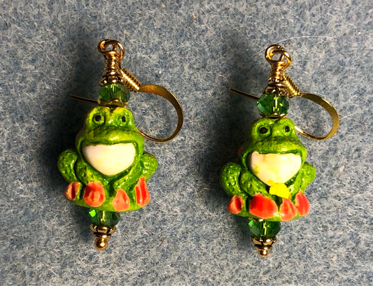 Small green, white, and orange ceramic frog bead earrings adorned with green Chinese crystal beads.