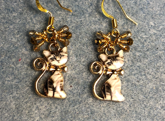 Tan, gray, and off white enamel cat charm earrings adorned with small dangling tan, gray, and gold Chinese crystal beads.