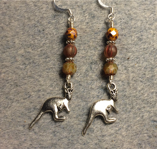 Silver kangaroo charm earrings adorned with orange brown Czech glass beads