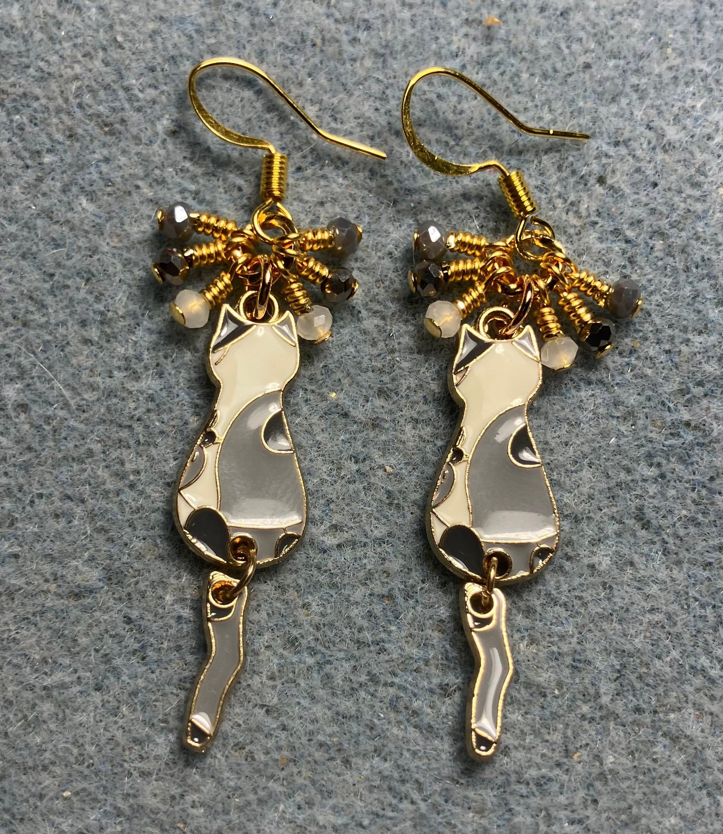 Dark gray , light gray, and white enamel cat charm earrings adorned with tiny dangling dark gray, light gray, and white Chinese crystal beads.