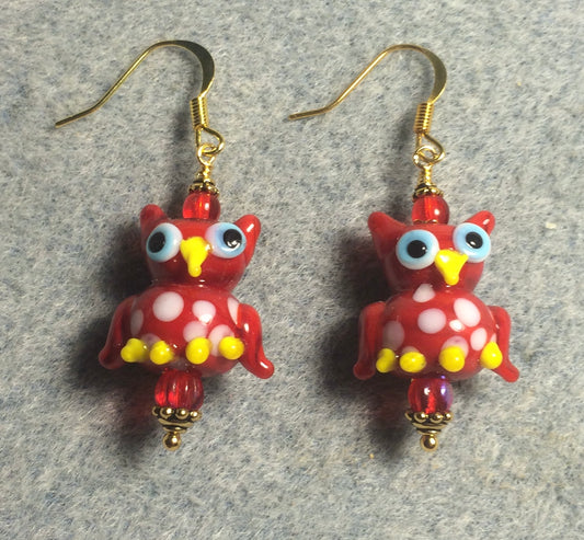 Red and white lamp work spotted owl bead earrings adorned with red Czech glass beads.