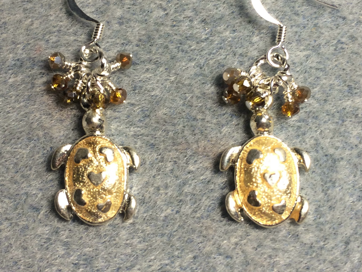 Silver and tan enamel turtle charm earrings adorned with tiny dangling tan Chinese crystal beads.