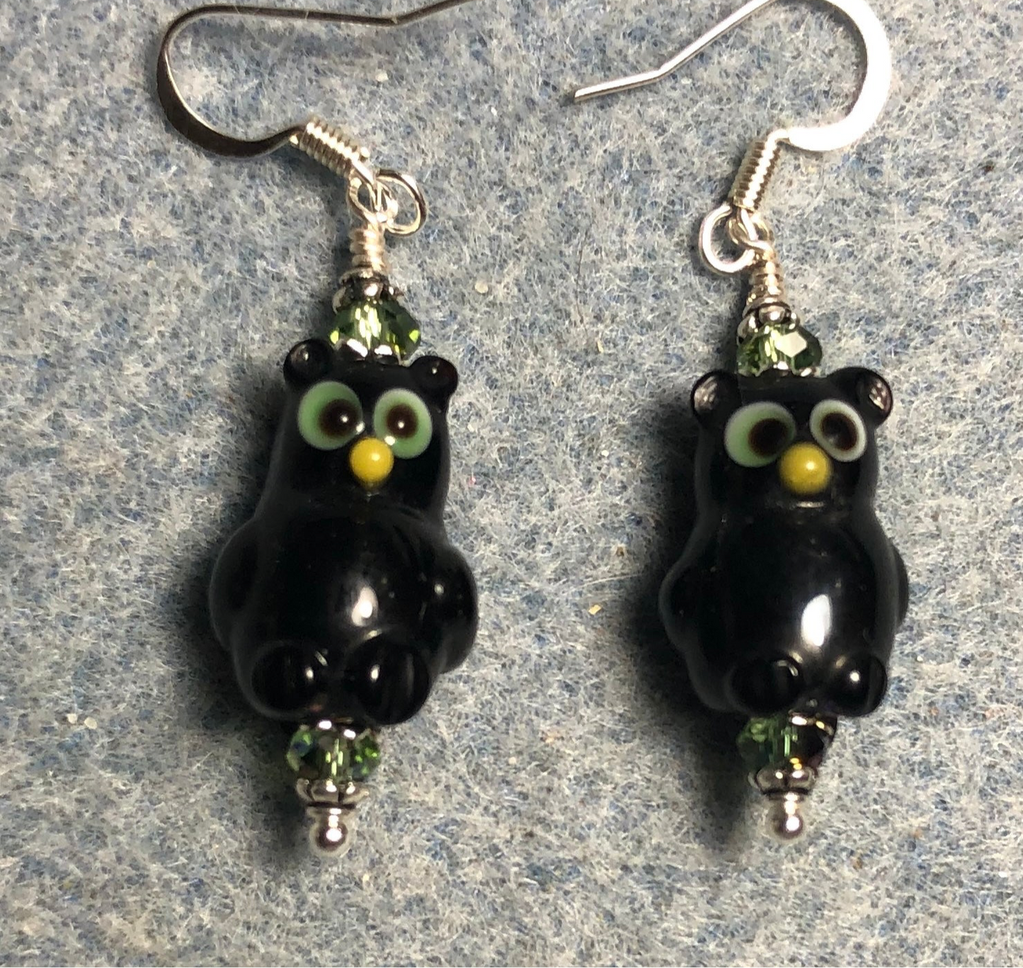 Black and green lamp work owl bead earrings adorned with sparkly green Chinese crystal beads.