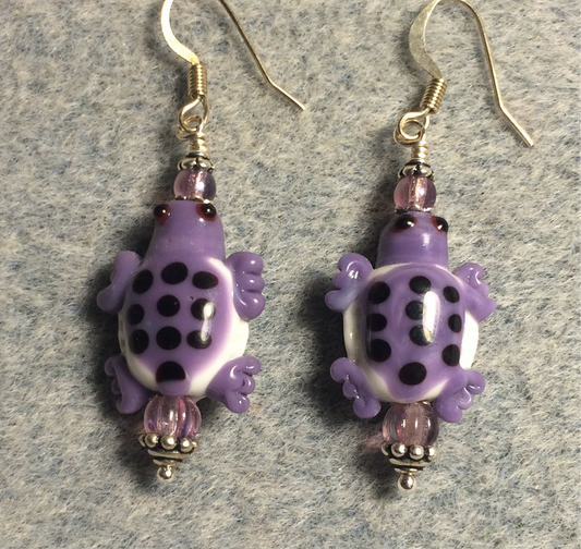 Purple and white lamp work spotted turtle bead earrings adorned with purple Czech glass beads.