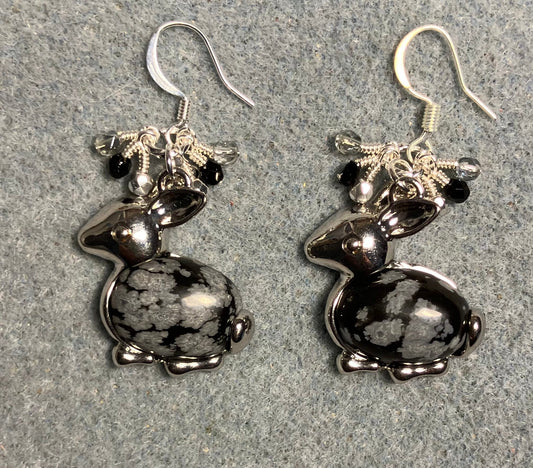 Large silver and snowflake obsidian gemstone rabbit charm earrings adorned with small dangling black, silver, and clear Czech glass beads.