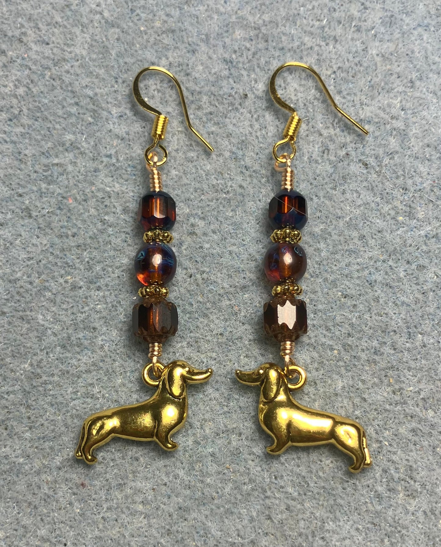 Gold dachshund charm earrings adorned with brown Czech glass beads