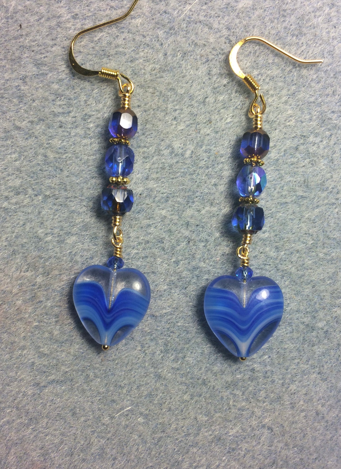 Bright blue Czech glass heart bead earrings adorned with bright blue Czech glass beads.